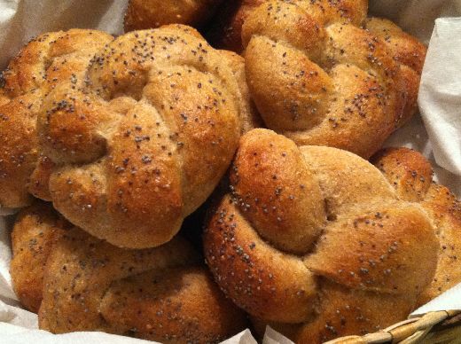 Knotted poppy seed rolls in a basket