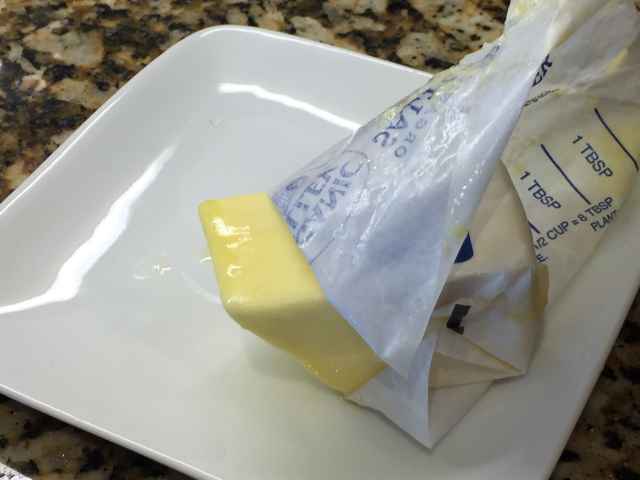 Butter with paper peeled back