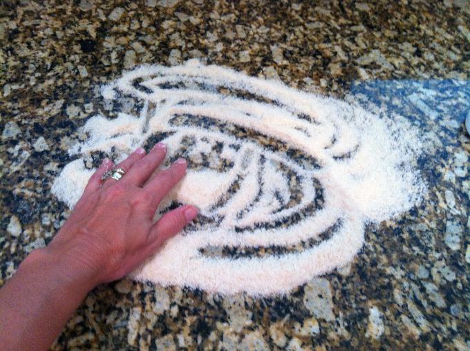 Dust work surface with cornmeal